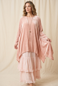 On-model visualization of the blush outfit with flowing drape