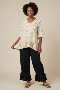 Outfit on a Black woman model showing natural fabric drape